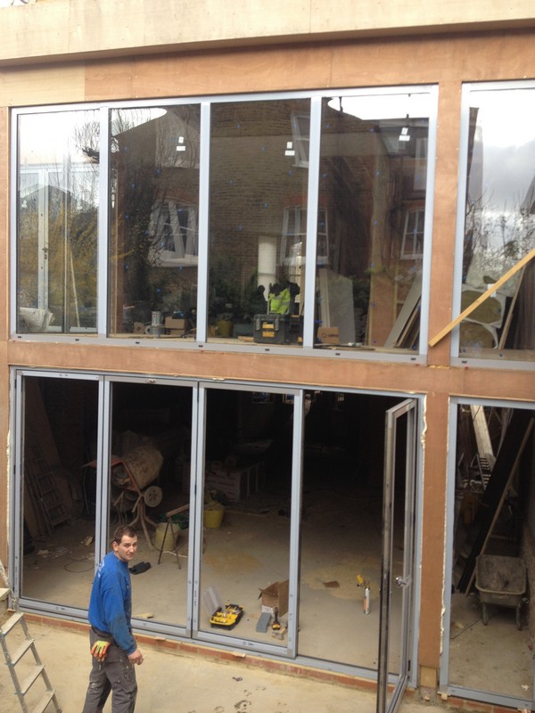 Aluminium bi-fold doors with two-storey glazing in Stanmore