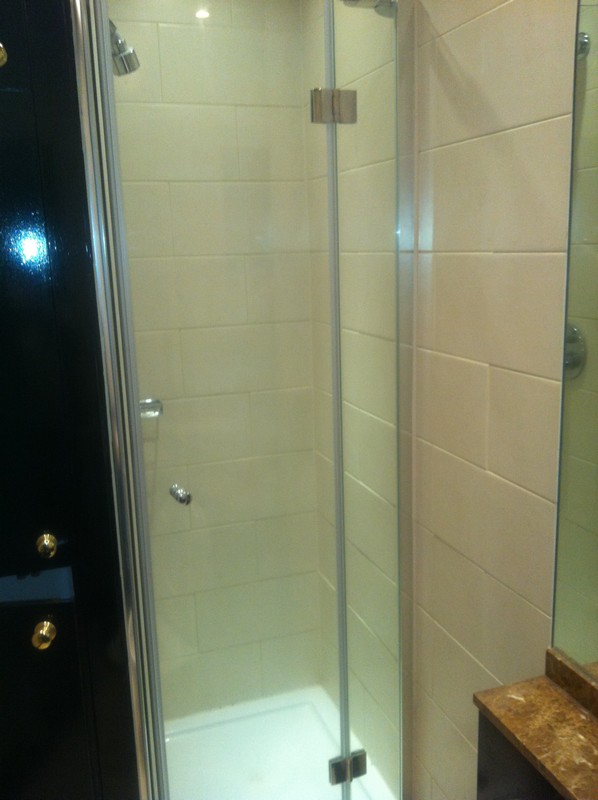 Frameless glass shower enclosure with chrome fittings in Stanmore
