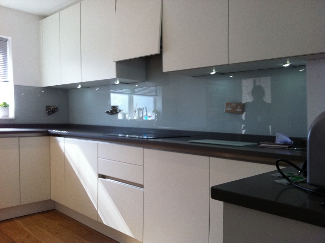 Grey glass kitchen splashback with LED lighting in Stanmore
