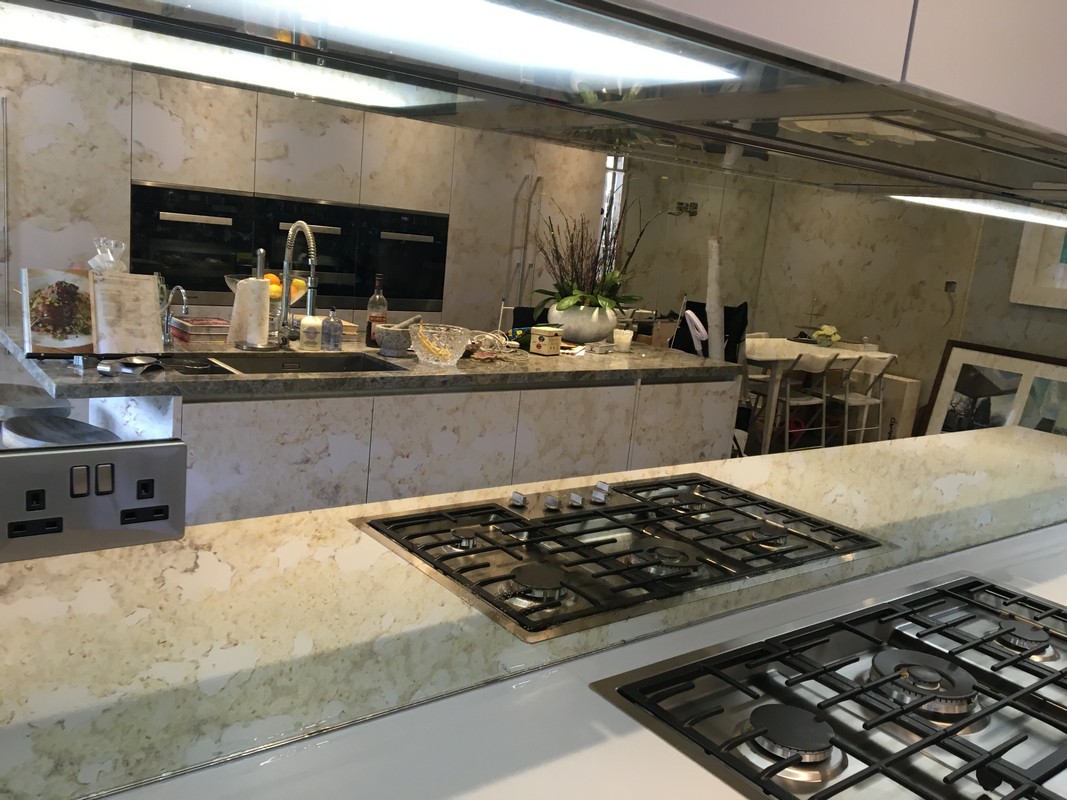 Mirror glass splashback in Stanmore luxury kitchen