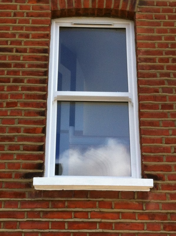 uPVC sash window on Victorian red brick house in Stanmore